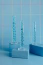 Various Measuring Cylinders on Pedestals