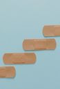 Brown Band Aids on Blue Surface