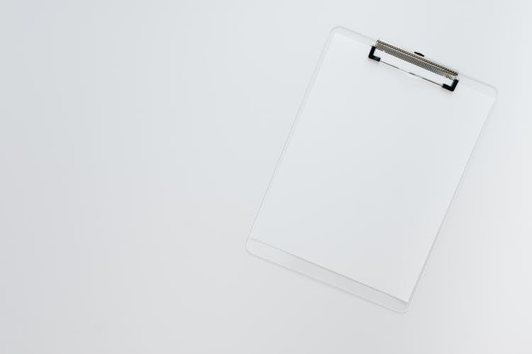 A White Sheet Of Paper On A Clipboard