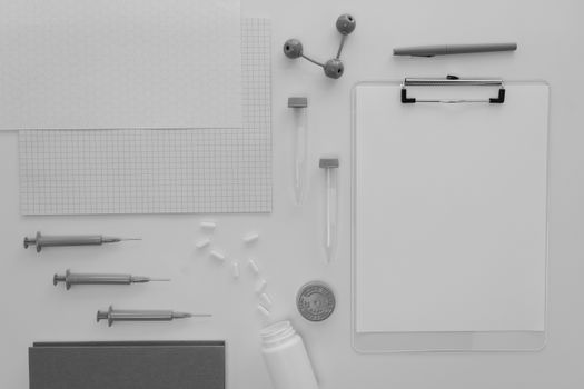 Organized flat lay of medical and laboratory supplies on a white background.
