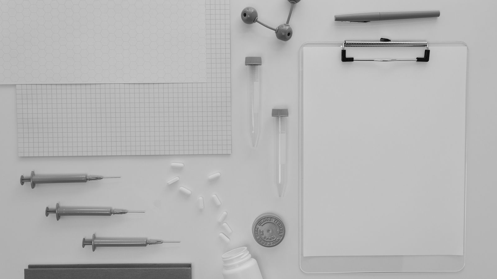 Organized flat lay of medical and laboratory supplies on a white background.