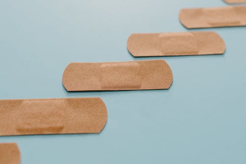 Band Aids On Blue Surface