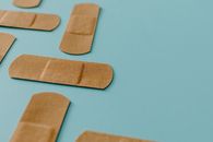 Brown Band Aids On Blue Surface