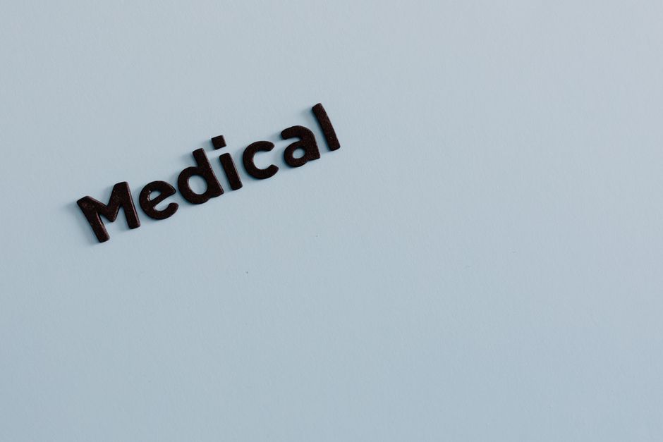 Simple typography of the word 'Medical' on a light background conveys healthcare concept.
