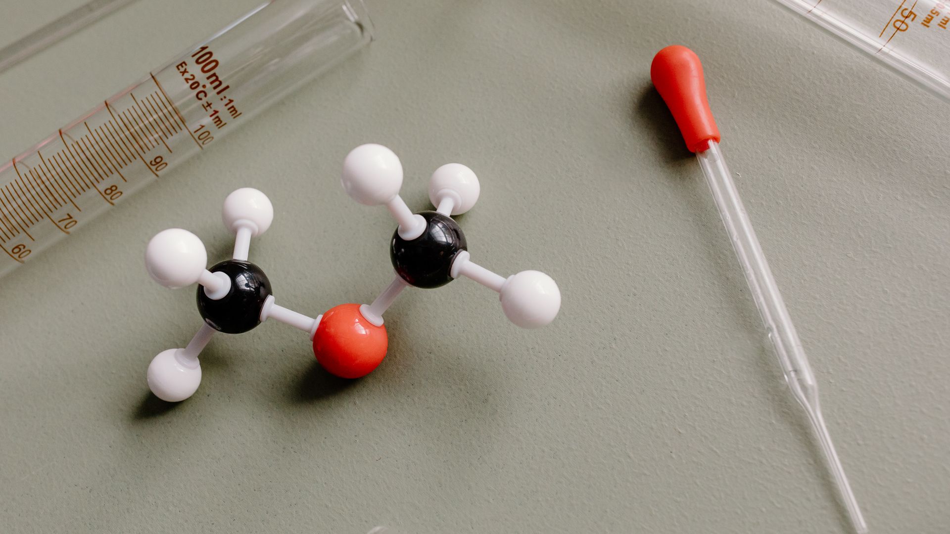 modafinil vs mind lab pro: Unlocking Cognitive Potential Close-up of laboratory equipment and molecular model on a flat surface — modafinil vs mind lab pro