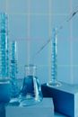 A Liquid Dropping to a Flask from a Pipette