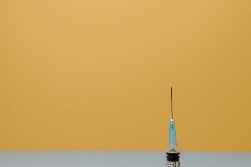 A Close-Up Shot of the Needle of a Syringe