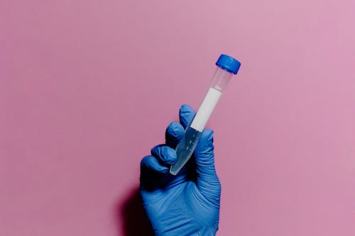 Free Close-Up Shot of a Person Holding a Test Tube Stock Photo