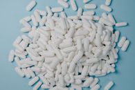 White Tablets on Blue Surface