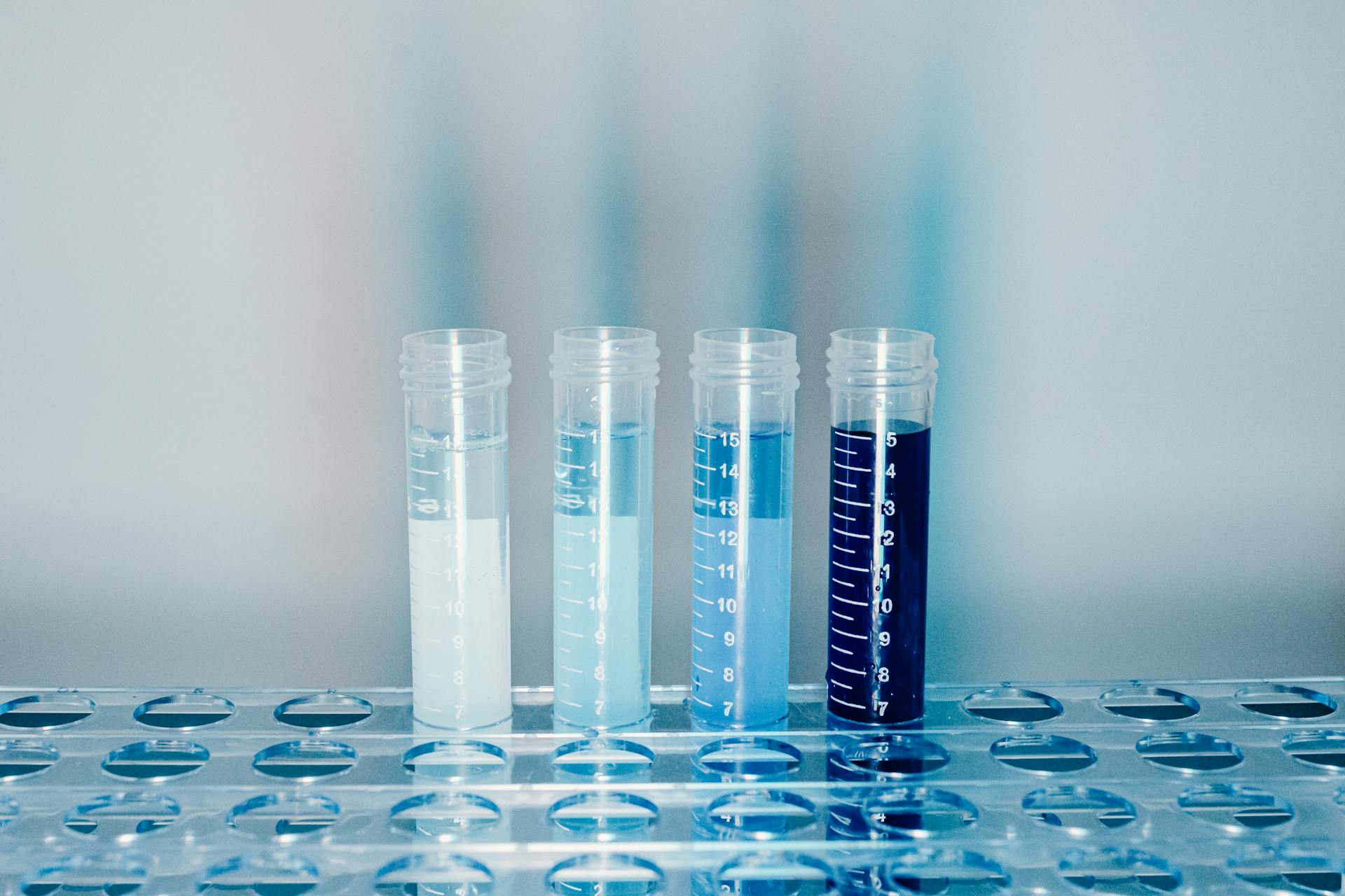 Clear Plastic Test Tubes With Blue Liquid