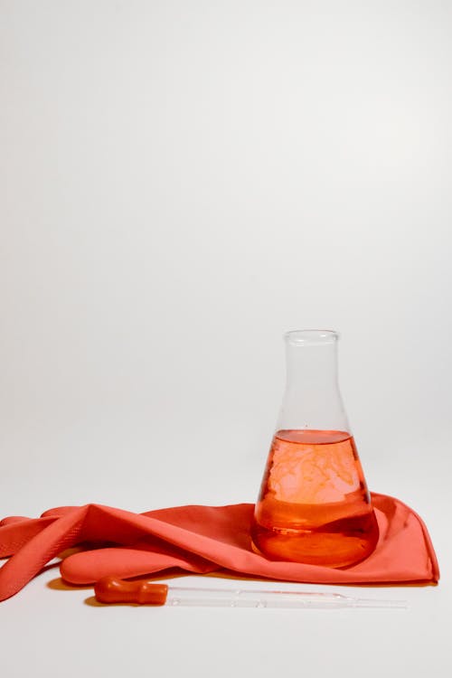Free Red Liquid in Clear Glass Bottle Stock Photo