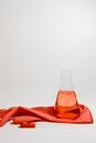 Red Liquid in Clear Glass Bottle