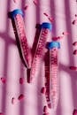 Plastic Tubes Filled with Pink Tablets
