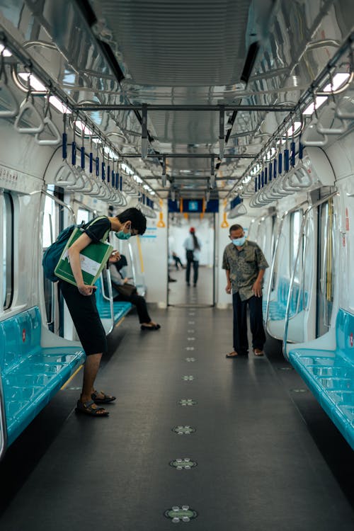 Passengers Commuting in a Train