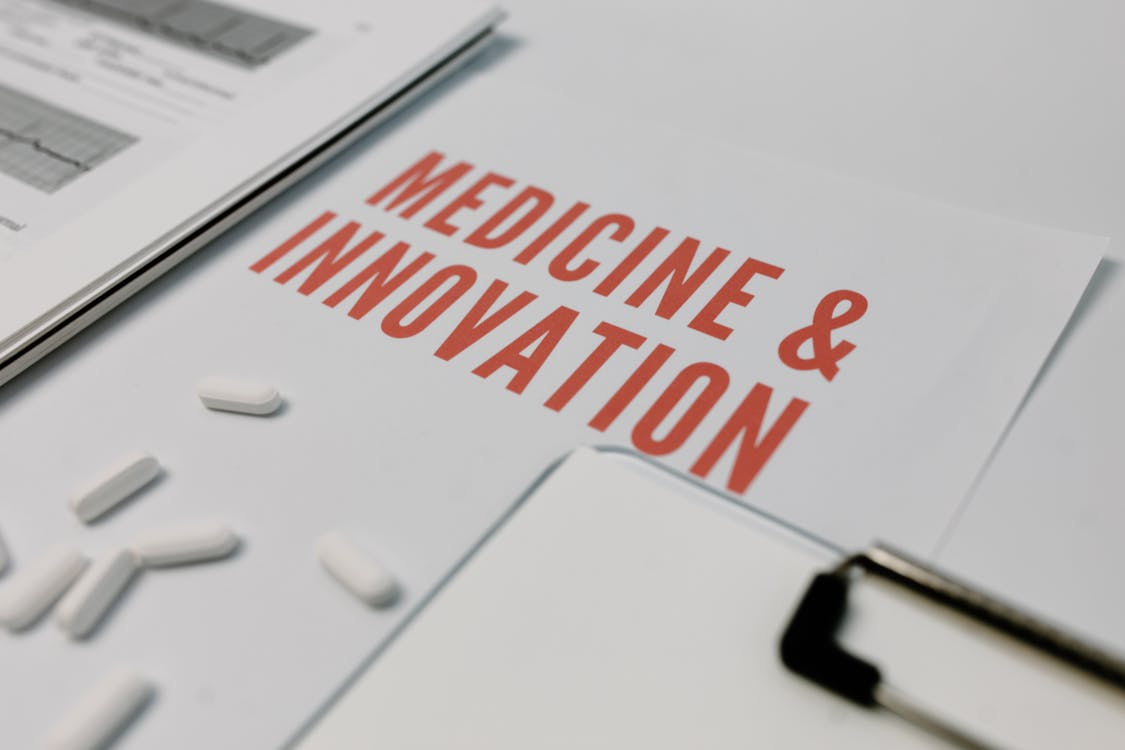 medicine and innovation written on a paper. 
