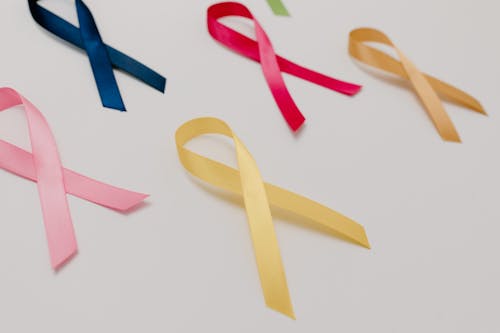 Close-Up Shot of Ribbons on White Surface