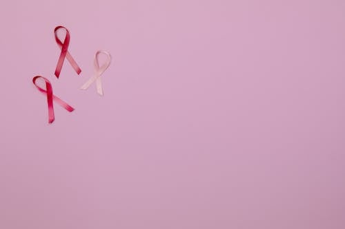 Free Breast Cancer Pink Ribbons on Pink Background Stock Photo