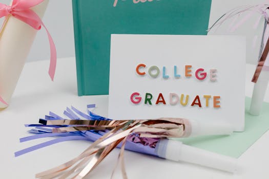 Festive college graduation setup with colorful letters, diploma, and party decor.