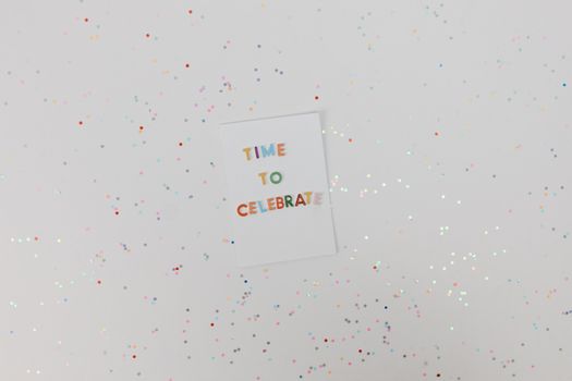 Colorful celebration card with confetti on a white background. Perfect for festive occasions.