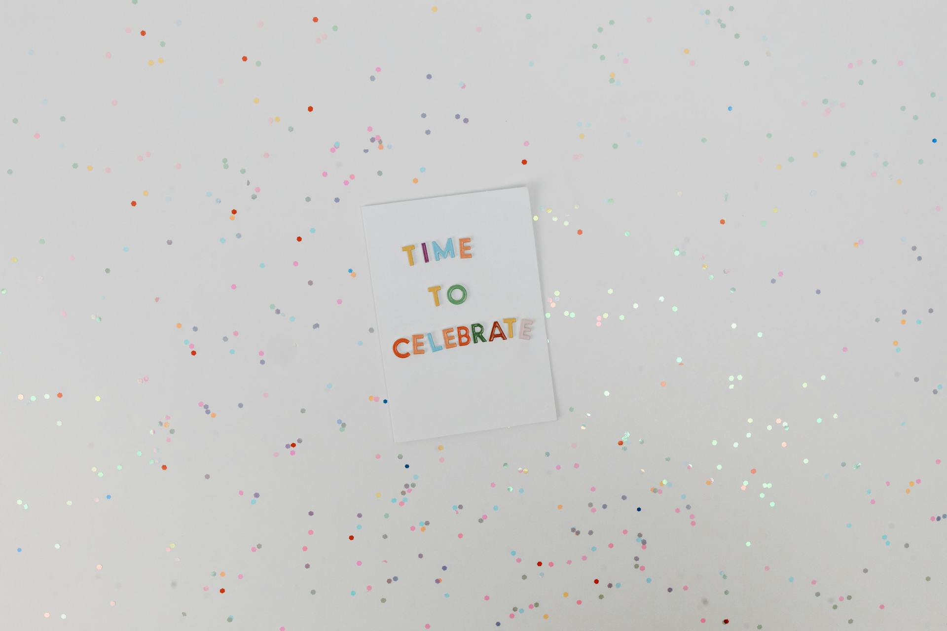 Colorful celebration card with confetti on a white background. Perfect for festive occasions.
