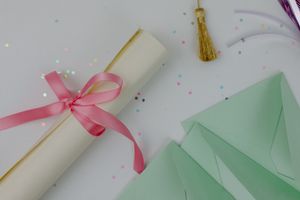 Graduation card with ribbon and confetti — photo by Tara Winstead on Pexels