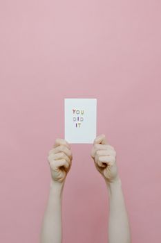 A Person Holding a White Card with a Message You Did It