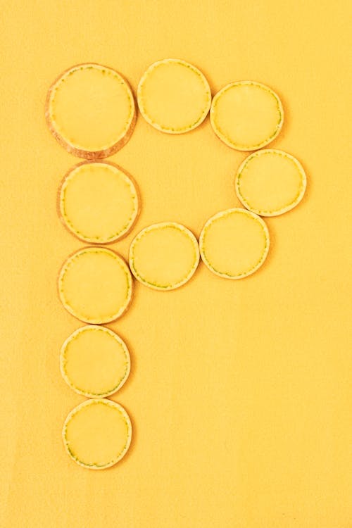 Gratis Fotos de stock gratuitas de círculos, fondo amarillo, formas Foto de stock