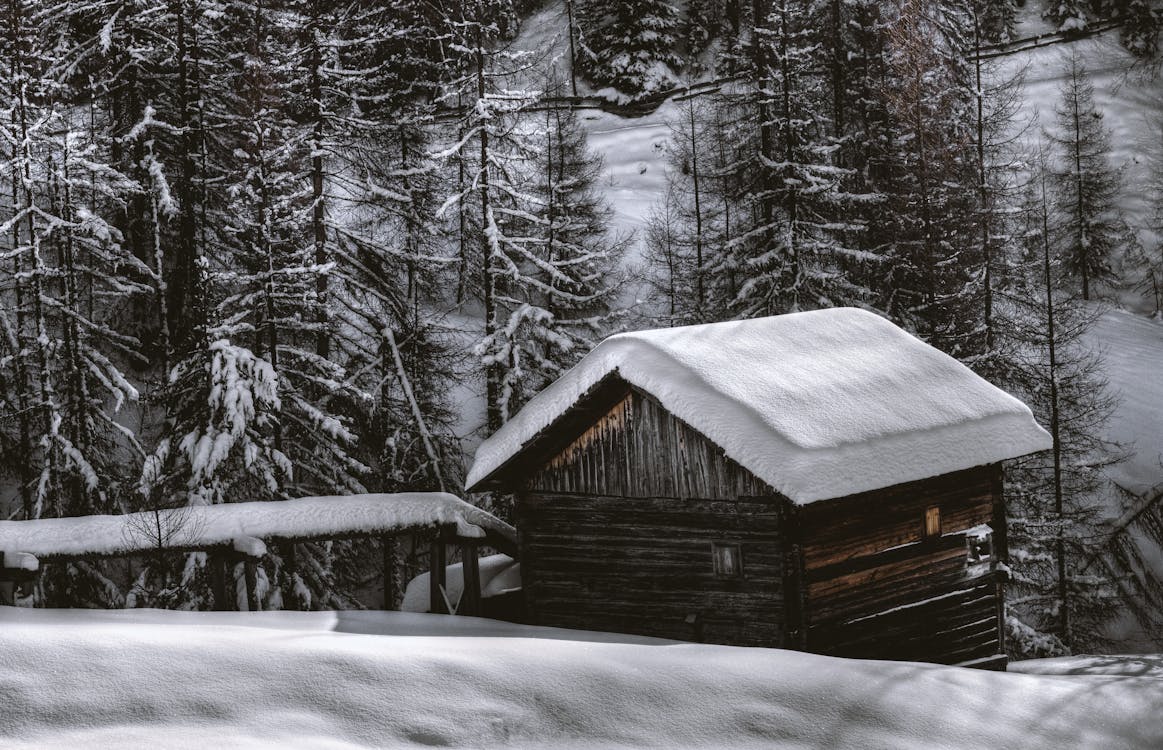 Brown Wooden Barn during Snow