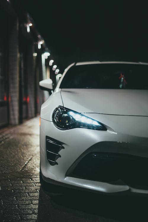 White Car on Road during Night Time