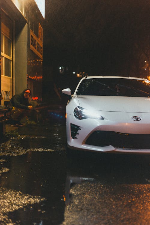 White Car Parked on Street during Night Time