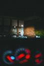 Brown Brick Building With Lights Turned on during Night Time