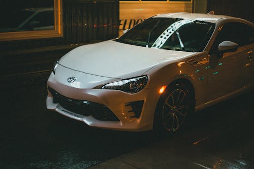 A White Toyota Car on the Road