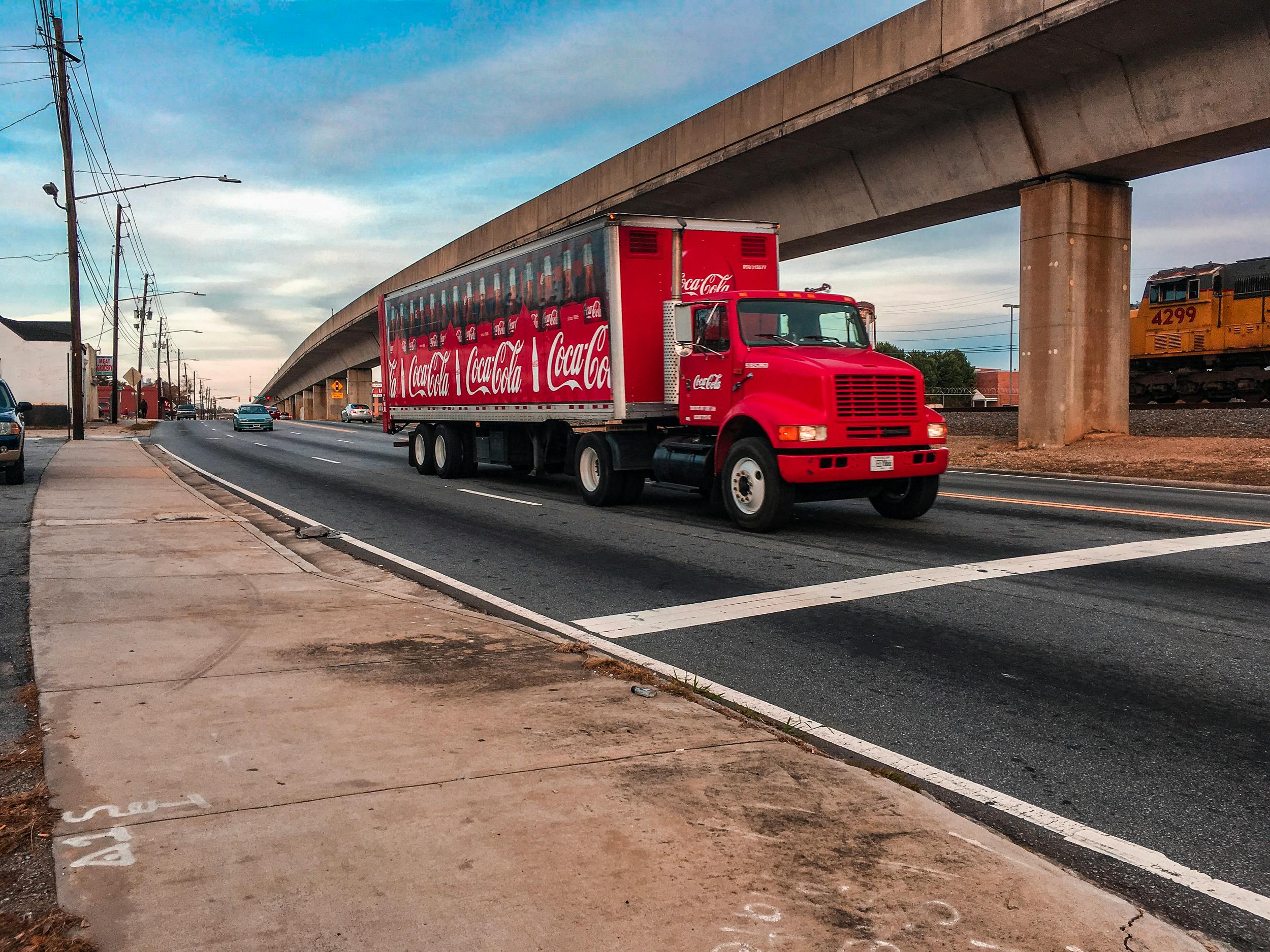 red and white truck on road