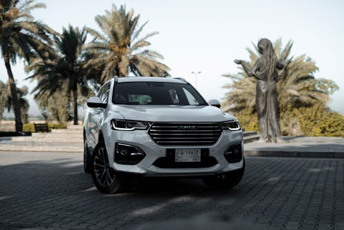 A Haval H2 Car Parked on a Brick Pavement