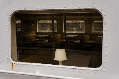 An Old Train Interior with Tables  and Chairs