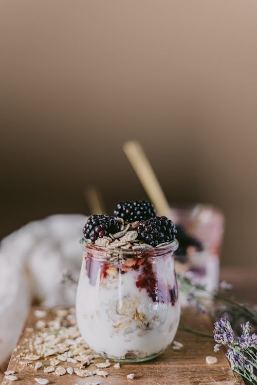 Clear Glass Cup With Ice Cream and Black Berries