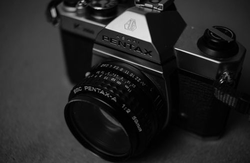 Free A detailed black and white image of a vintage camera, showcasing its features. Stock Photo