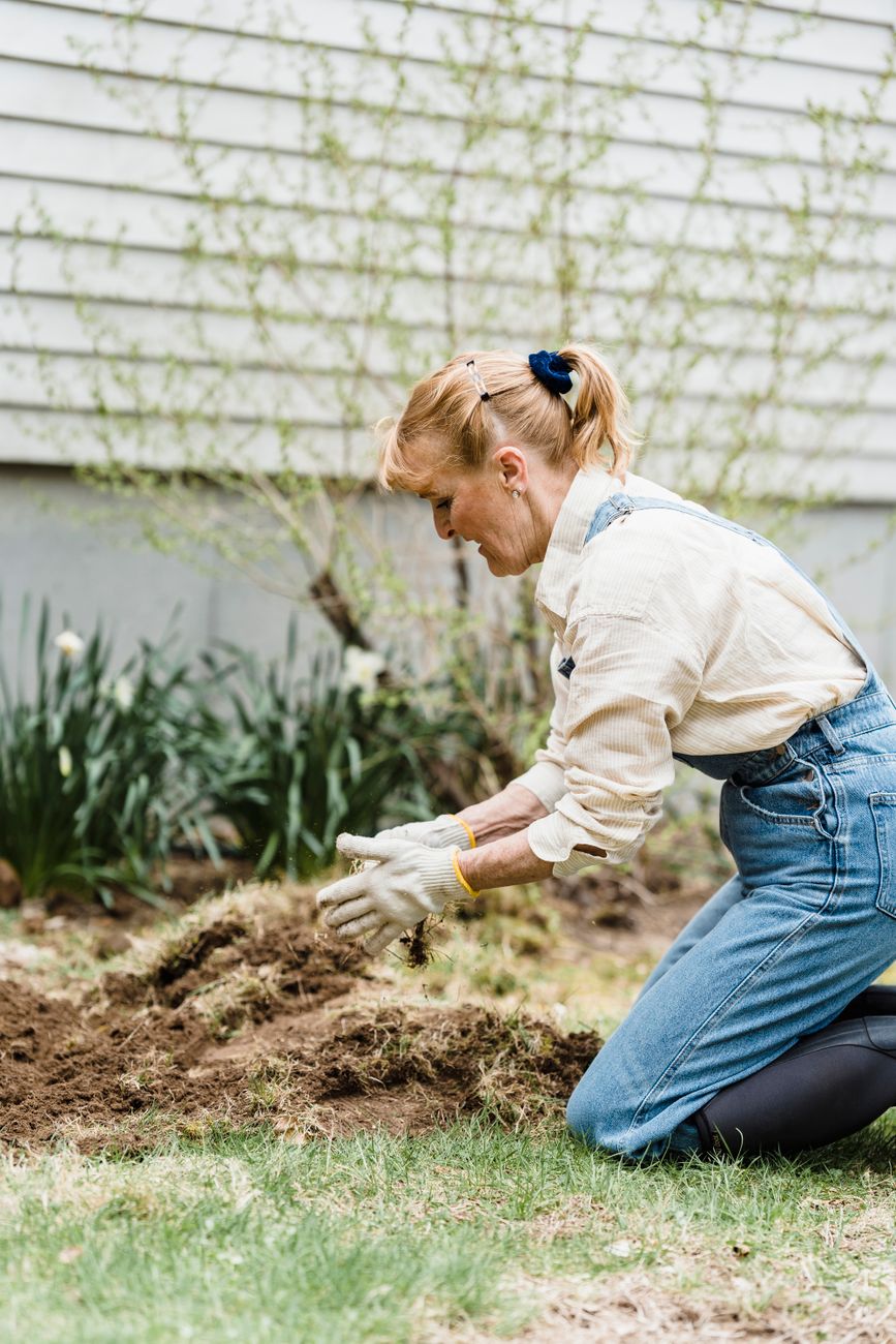 gardener removing toxic plants safely