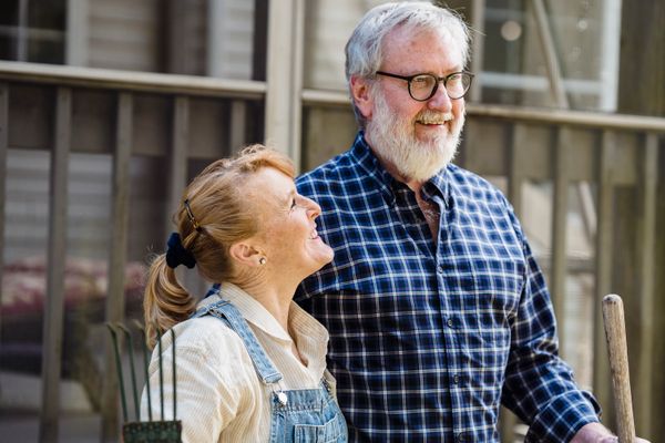 Senior couple active and independent at home, gardening together