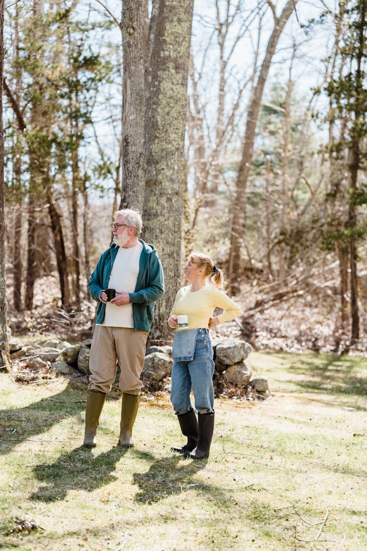 Mature Couple In Sunny Forest