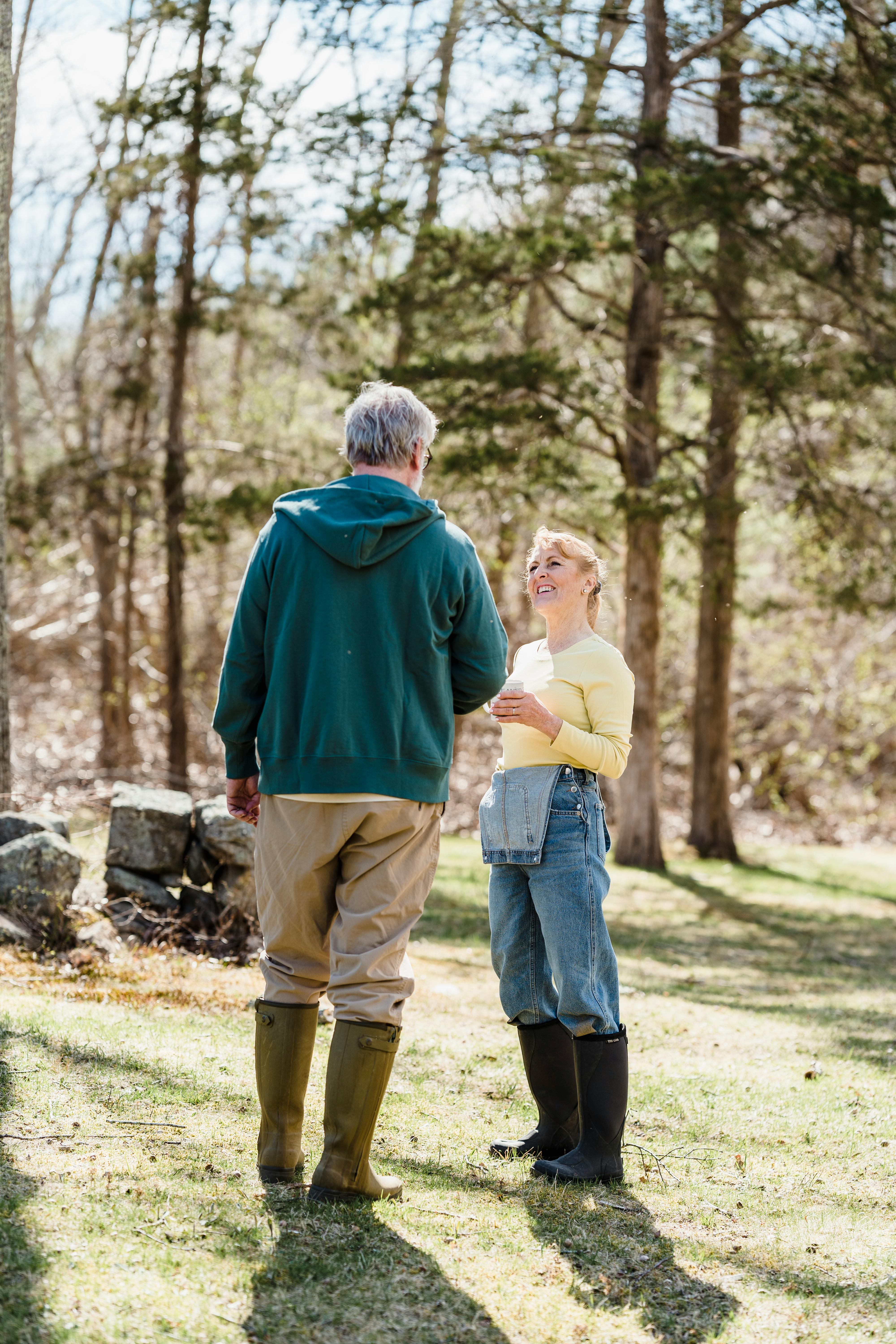 couple talking in green forest