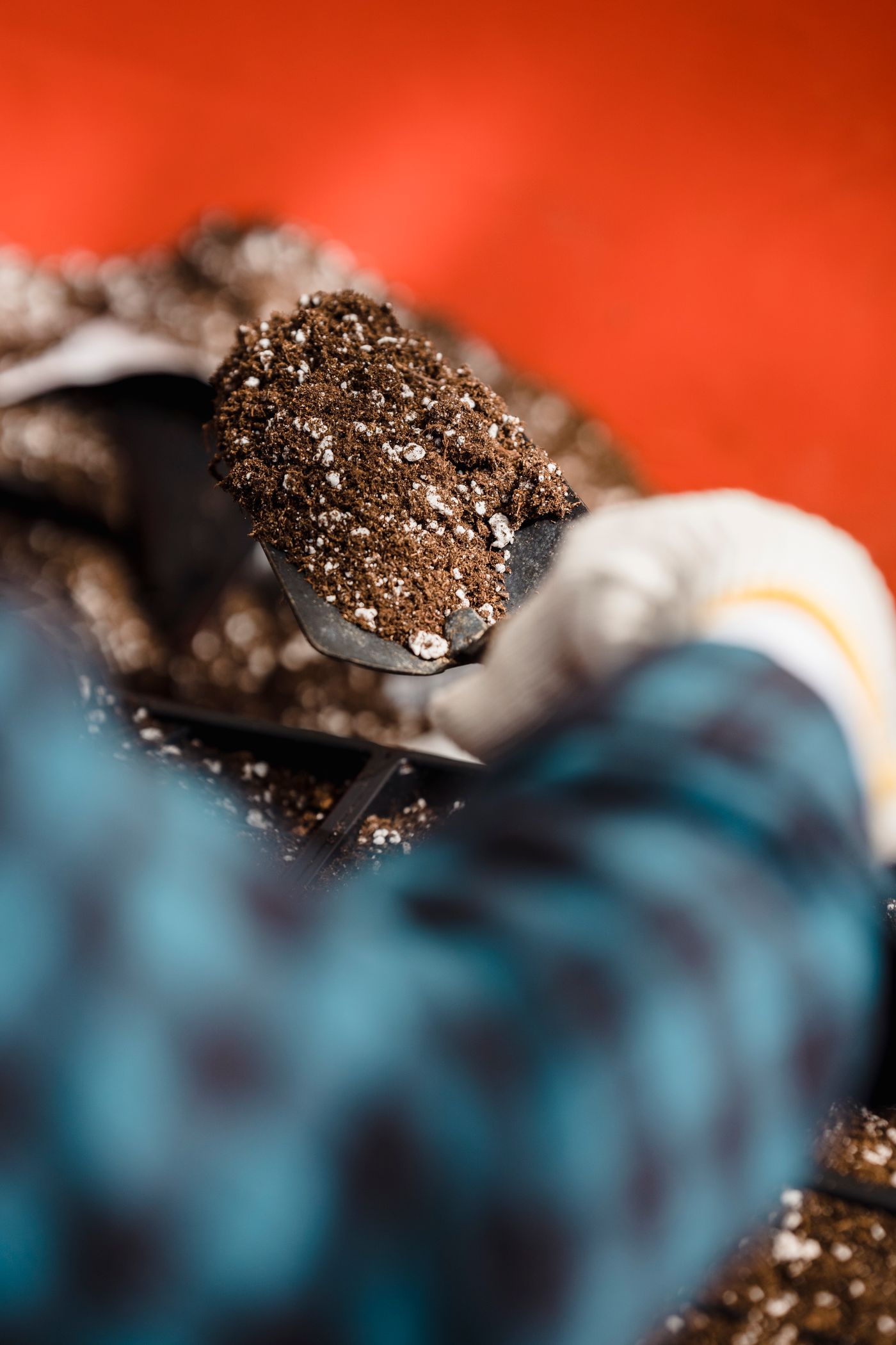 Worker handling soil during outdoor work