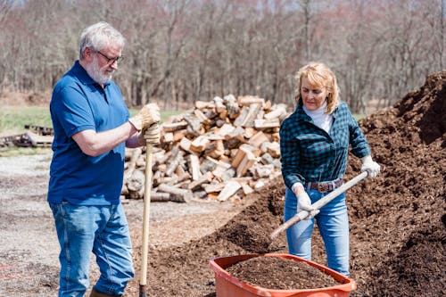 Free Elderly Couple Shoveling the Soil Stock Photo