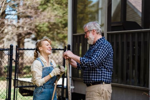 happy senior couple gardening