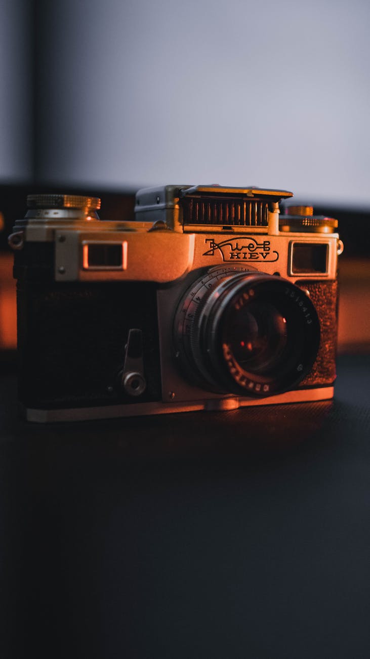 Captured in low light, this vintage camera evokes nostalgia and retro charm.