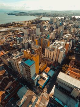 Stunning aerial photograph showcasing the vibrant cityscape of Florianópolis, Brazil, with lush scenery and ocean view.
