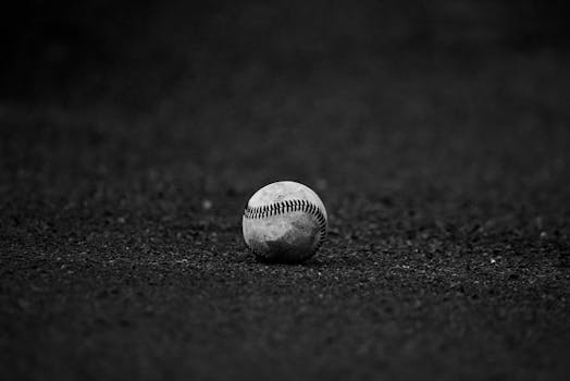 Selective Focus Grayscale Photography of Baseball
