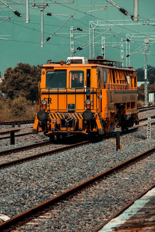 Yellow and Black Train on Rail Tracks