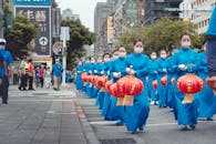 The New Normal Parade of Chinese Lanterns by Women in Blue Dress