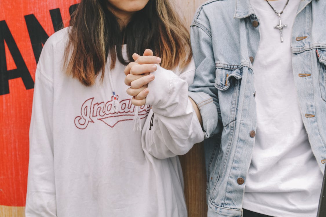 Free Woman Holding Man's Hand During Day Stock Photo